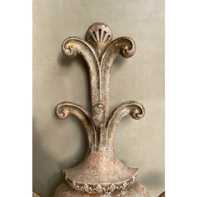 This piece is full of French charm with its palm frond like elements. It truly makes a stunning visual statement and would...