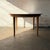 A monumental Model 62 extension dining table designed by Henning Kjærnulf for Sorø Stolefabrik, Denmark. This example...
