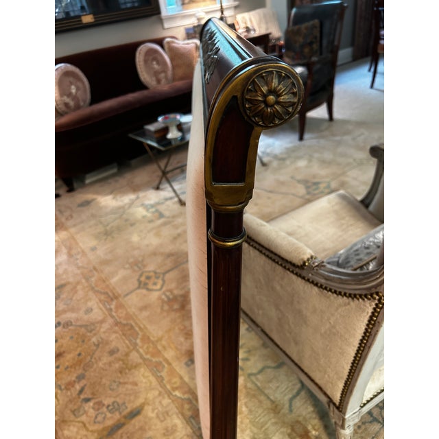Vintage pair of neoclassical style mahogany headboards with gilt details by John Widdicomb. Each measures 41” high and 41”...