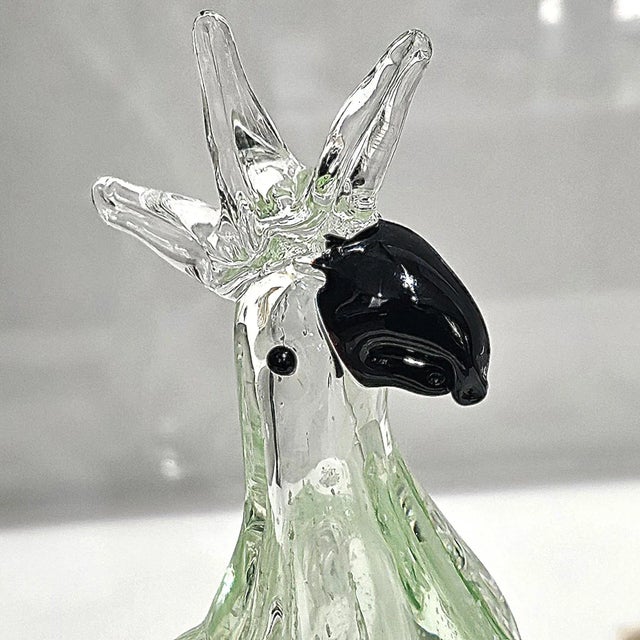 Murano-inspired handblown glass parrot sculpture in green and clear glass, marked ‘Gorgeous Design – China’, perfect for...