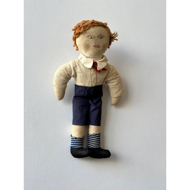 Antique Clothed Cotton Rag Doll with Embroidered Face, Circa Early 20th Century. Woolen yarn strawberry blonde hair and...