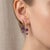 Elevate your everyday style with a touch of modern royalty. These exquisite drop earrings feature two beautifully faceted,...
