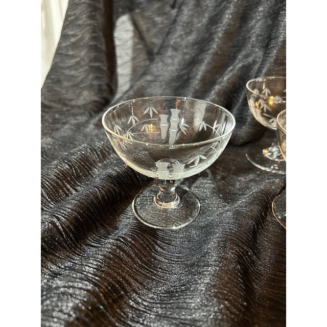 Set of 13 Sasaki by Noritake crystal champagne/low sherbert glasses. Hand etched with delicate Bamboo pattern of stalks...