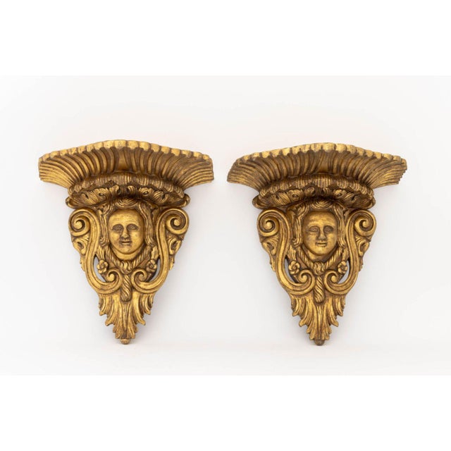 Pair of Baroque Style Gilt Masque Wall Appliques, with scrolling foliate motifs. 18" H x 18.75" W x 13" D. Provenance:...