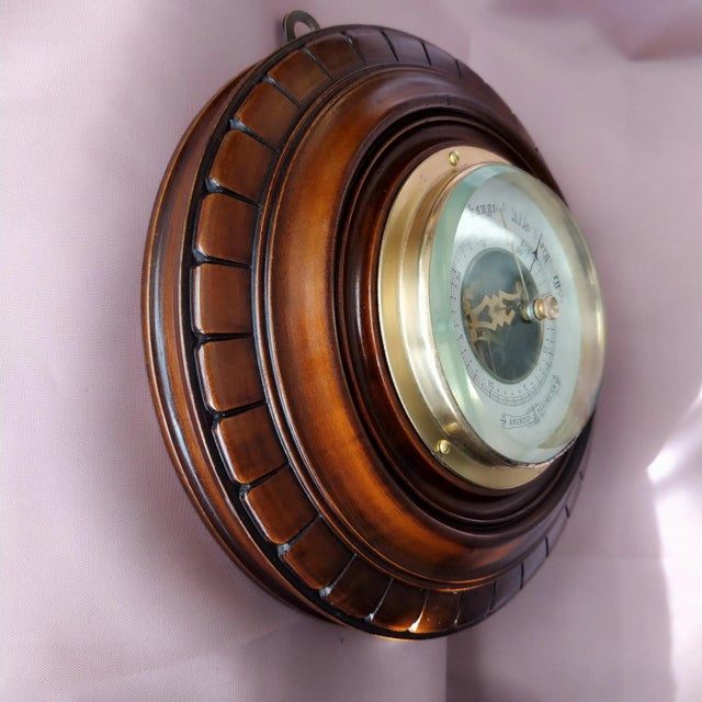 An exceptional late 19th-century French aneroid barometer featuring a captivating "skeleton" dial that reveals the...