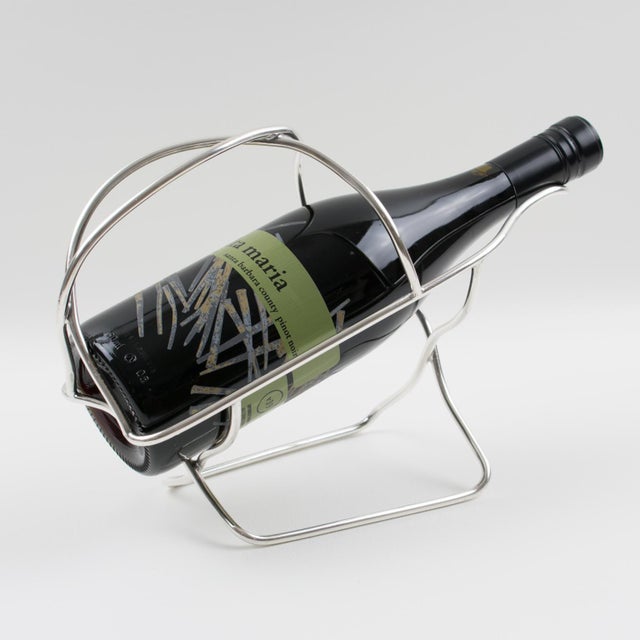 French silversmith Ercuis, Paris, designed this stunning silver plate bottle holder, wine pourer, or server in the 1950s....