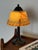 This table lamp dates from the Art Deco period and is Scandinavian in origin. The bell-shaped shade is pressed glass in a...