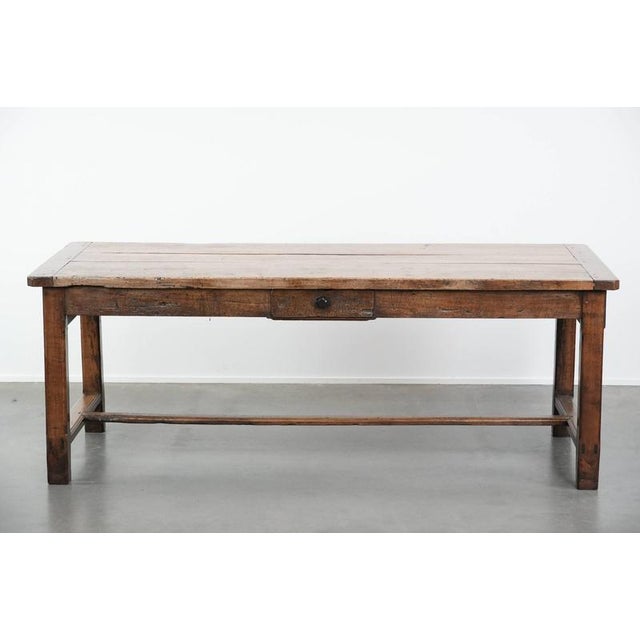 For sale by Thijs is this stunning, robust, antique French farmhouse dining table with three drawers from the 18th...