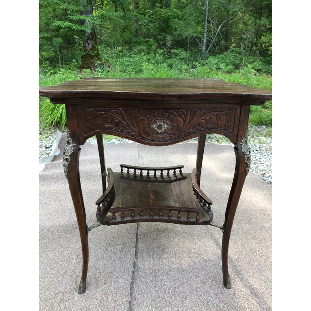 A rare antique English Queen Anne walnut table showing an elegant design with beautiful shaped scrolled legs with some...