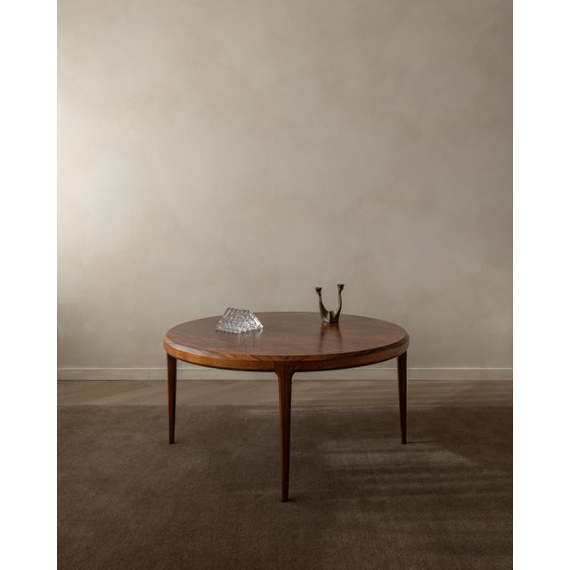 A vintage danish modern rosewood coffee table, designed by johannes andersen for cfc silkeborg and produced in denmark...