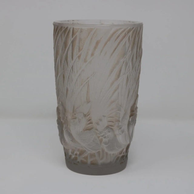 Rene Lalique clear and frosted glass 'Coqs Et Plumes' Vase. Sepia staining to the details. This pattern features...