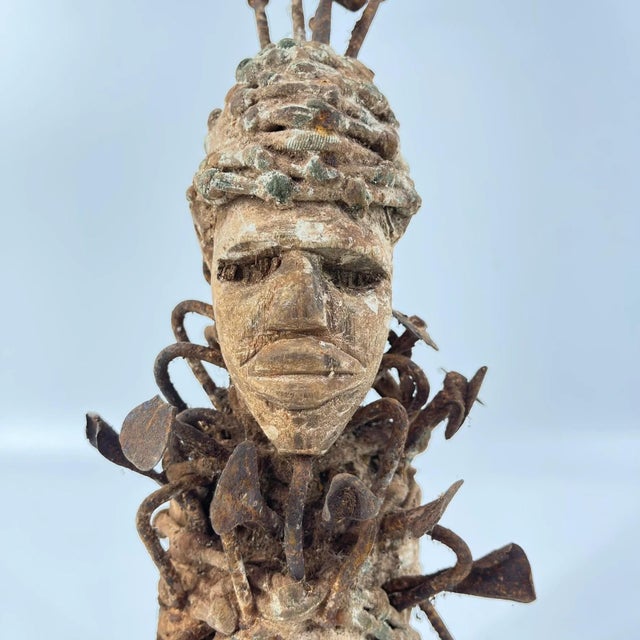 The Kongo Nkisi Nkondi Power Fetish Figure from Congo is a striking, handcrafted spiritual object used in rituals to...