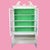 A tall mid-century cabinet in white with ornamental detailing, standing over eighty inches for dramatic storage and...