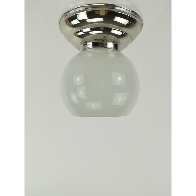 Small ceiling lamp with opal overtaking glass, optimal for smaller rooms. The lamp gives a cozy non-dazzling light. Re-...