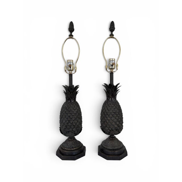 An exquisite pair of Bronze Pineapple Table Lamps in the style of Maitland Smith with original Faux Tooled Leather Shades....