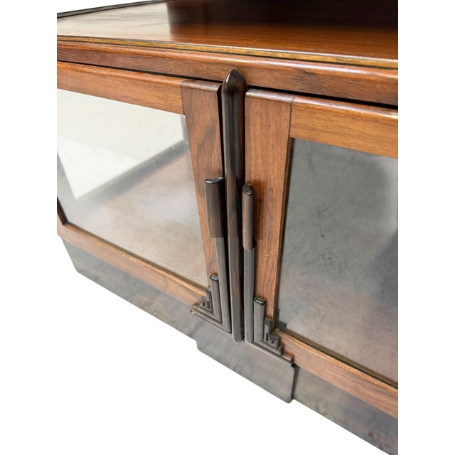 Magnificent and rare Art Deco Amsterdamse School display cabinet. Striking Dutch design from the 1920s. Solid padouk with...