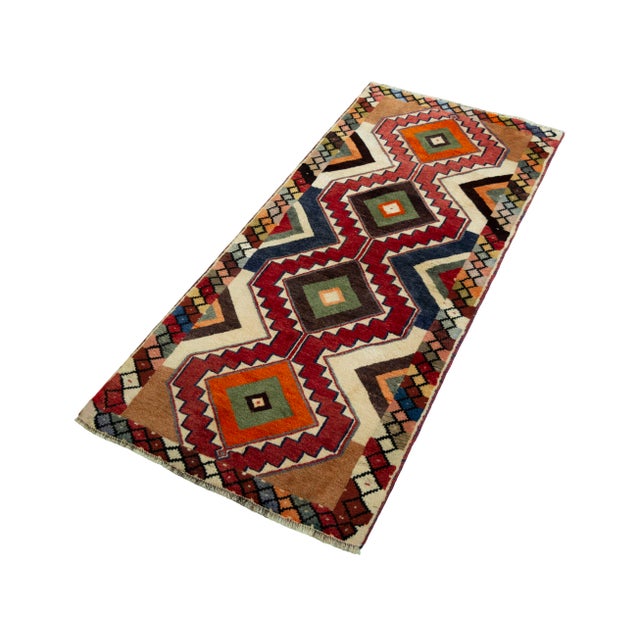 This colorful, hand-knotted Gabbeh nomad rug, measuring 183 x 84 cm, is truly unique and brings vibrant energy to any...