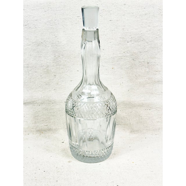 Beautiful vintage cut glass decanter. Intricate design. Perfect to use in any bar or to give as a gift. This is a pre-...