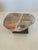 Striking abstract marble sculpture having marvelous pink, grey and white lively grain, on custom black base.