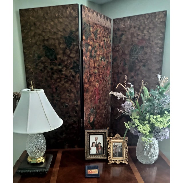 Asian hand painted lacquer tri-fold with colorful parrots, dressed monkeys, greens. browns. greens and reds.