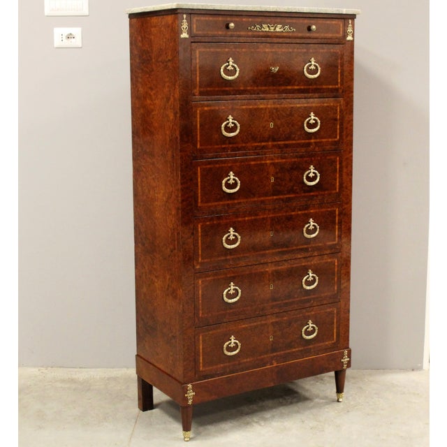 Napoleon III marquetry chest of drawers, with a marble top and splendid original gilded bronzes. Second half of the 19th...