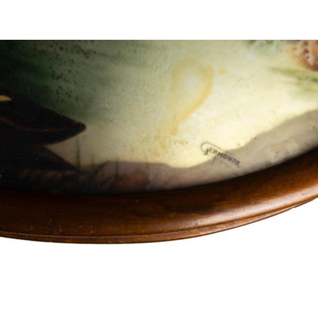 An Art Nouveau oval tray signed by Germonde with a pyrographic landscape etched in the bottom with metal handles. An old...