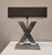 Styling table lamp with x -shaped steel arm and rectangular black screen. This Mid Century -style lamp is a perfect...
