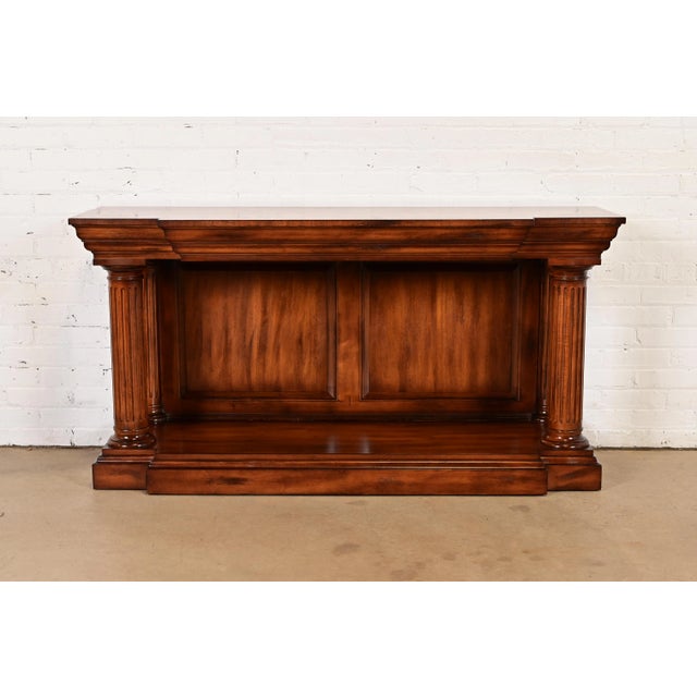 An outstanding Empire, Neoclassical, or Regency style console table, sofa table, or entry table with Greco Roman column...