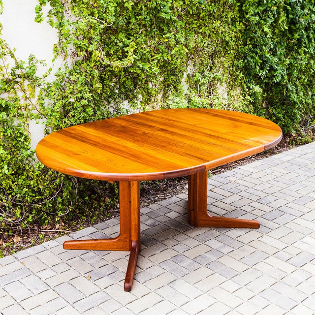Refinished mid century modern split pedestal base dining table from Denmark. With the two included leaves it expands from...