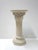 A vintage pedestal plant stand with acanthus leaf decoration supporting the top and a Moorish design on the column. This...