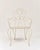 Set of 3 white wrought iron chairs. Elegant and charming with their graceful curves, they will add a romantic touch to...