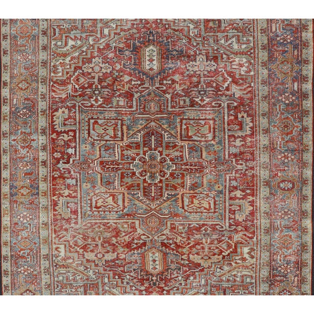 Measures: 7'11"X10'3" Antique Persian Heriz Rug With Striking Geometric Medallion and Intricate Detailing 7'11"x10'3"....