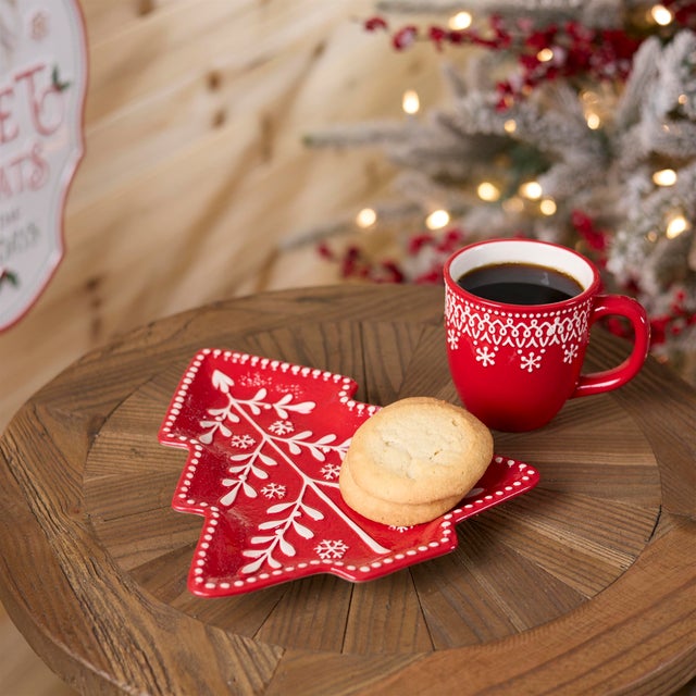 Bring sweet holiday charm to your table with this Red Tree Ceramic Plate Set. Designed in the shape of a cozy pine tree...