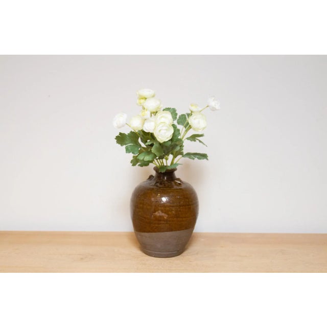 This small antique terracotta pot is original from the Martaban era of Burma. It features a narrow opening on top that...