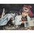 This framed limited-edition giclée on canvas depicts a traditional figurative scene featuring a child reclining on an...