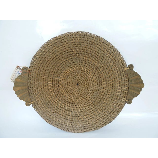 Hand made Hapao Saucer Basket hand made from split rattan with a spiral 'twisted' rattan core and carved fruitwood...