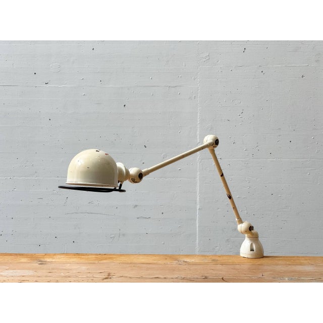 Iconic industrial articulated lamp from france, designed by jean-louis domecq and manufactured by jieldé. This model...