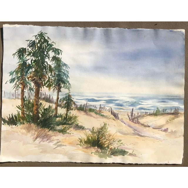 Coastal beach watercolor painting by artist Ingrid Hofer (1926-2019). Signed and location on back. This was probably...