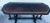 Black Antique Mahogany entrance/console table. Hand carved gated legs Oval top with a slight goldish flair on top. Very...