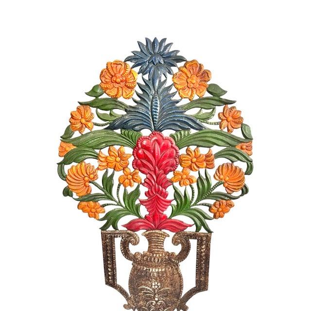A vibrant table lamp or wall sconce in the form of a handled urn with flowers. Made of thin, cut metal. Most suitable as a...