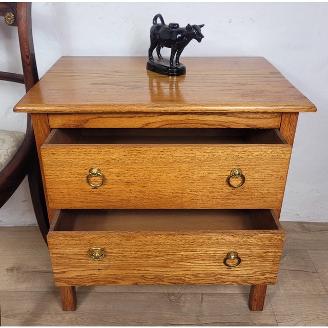 This Oak Vintage Chest of Drawers is a stylish and practical addition to a country bedroom setting. Circa 1980. The chest...