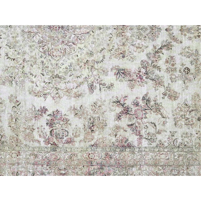 1940s Persian Kerman Carpet. Hand woven in the Kerman region of Iran. Distressed and refinished in the U.S. The Persian...