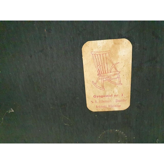 Rocking chair attributed to Illum Wikkelso for Niels Eilersen, model Gyngestol nr 3. The black paint has been repainted....