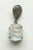 A pair of rainbow moonstone drop earrings featuring a carved floral design on the top of the rectangular cabochon...