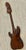 1970s Solid teak hand carved sculpture of a Japanese bass guitar. All of the nuances are here. Beautifully carved from one...
