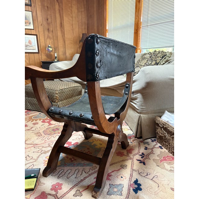 Bring historic, old-world elegance to your space with this stunning Renaissance Revival X-frame armchair, designed in the...