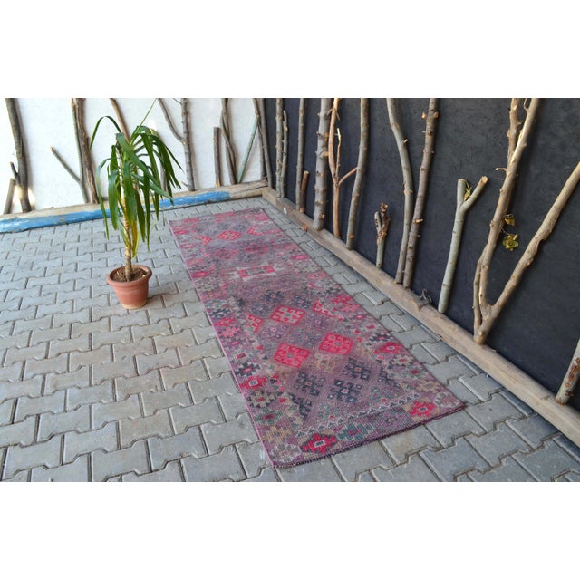 This spectacular Turkish handmade runner rug was handmade in Anatolian lands in the mid 20th century. This Vintage Oushak...