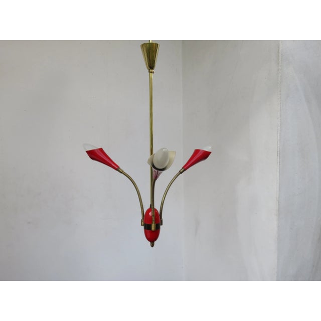 - Arms made of brass - Sockets painted in red aluminum - 3 E14 sockets - Diameter depending on the position of the arms 20...