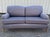 George Smith Standard Arm Sofa with foam seat cushions on turned legs with brass casters.