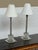 Design Plus Gallery presents a Pair of Heavy Column Table Lamps. The lamps have a crystal-like column with chrome finished...